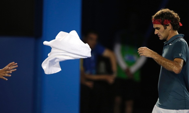 Roger Federer of Switzerland throws a towel between points as he plays Rafael Nadal of Spain during their semifinal at the Australian Open tennis championship in Melbourne.