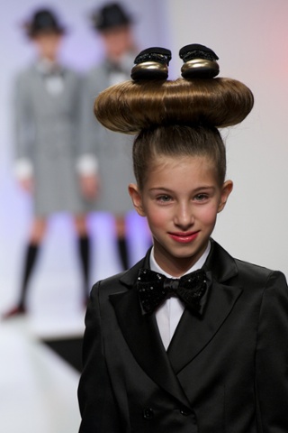 Models walk the runway during the FIMI Kids International Fashion Show 2014 at the Real Fabrica de Tapices in Madrid, Spain.