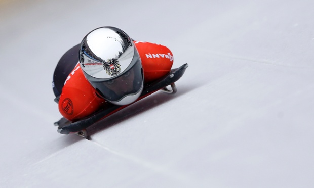 Janine Flock of Austria speeds down the track during her first run of the women's Skeleton World Cup race in Koenigssee, Germany.