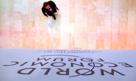 A participant makes his way to a session during the annual meeting of the World Economic Forum (WEF) in Davos January 24, 2014.