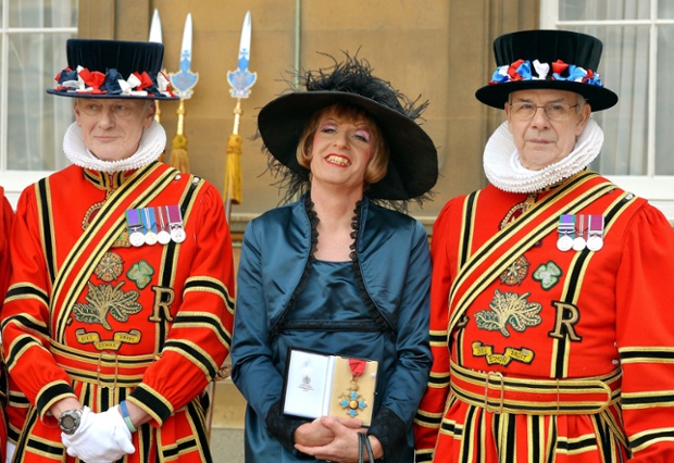 Artist Grayson Perry holds his CBE presented by the Prince of Wales during an investiture ceremony at Buckingham Palace, London.