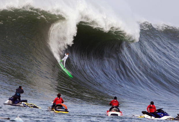 Nic Lamb rides a wave during the third heat of the first round of the Mavericks Invitational big wave surf contest in Half Moon Bay, California. 