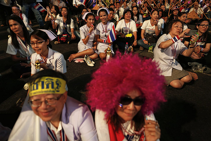 20 Photos: Nurses and other anti-government protesters listen to a speech in Bangkok