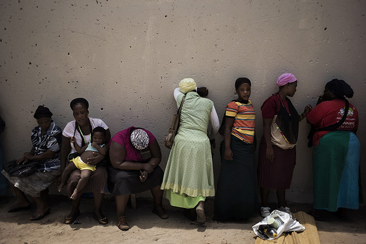 20 Photos: Women outside a newly built house in Nkandla, South Africa