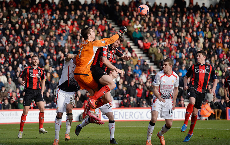 Bournemouth v  Liverpool : Brad Jones punches clear of challenge from Elliot Ward