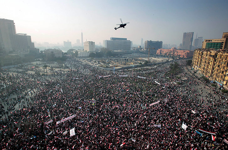 Cairo protest: An Egyptian army helicopter flies over the crowd