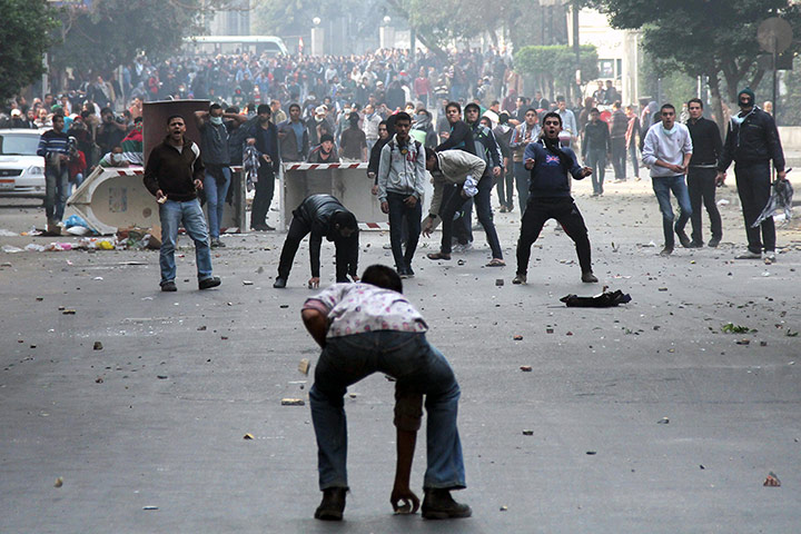 Cairo protest: Muslim Brotherhood supporters (backgroun