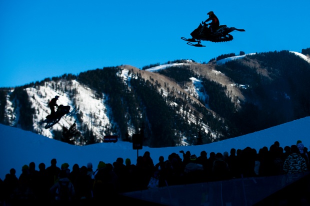 Cody Thomsen flies high above the crowds as he races in the Snowmobile SnoCross finals during the Winter X Games in Aspen, Colorado.
