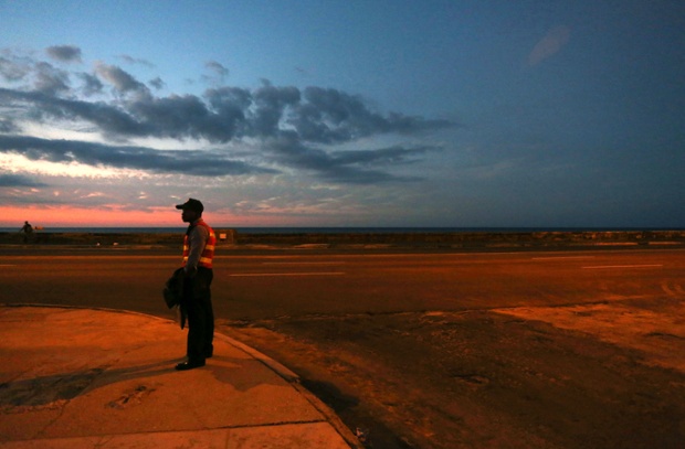 A police officer stands guard at the Malecon in Havana, Cuba. Leaders from Latin America and the Caribbean are arriving in Havana for the Community of Latin American and Caribbean States, or CELAC summit.