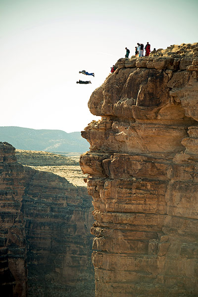 BASE jumping in Utah: Others watch as two parachutists plummet towards the ground