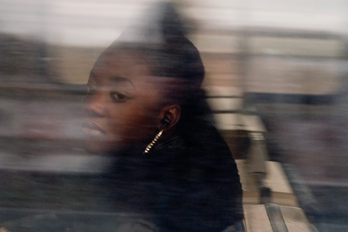 Big Picture - Commuters: blurred shot of young girl looking out of train window