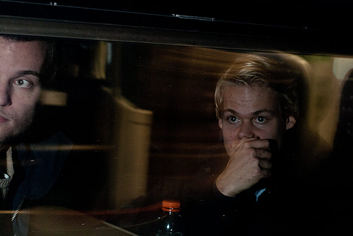 Big Picture - Commuters: boy with blond hair looking out from train window