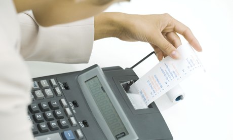 Person using adding machine