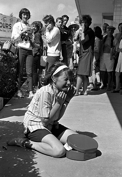 Beatles in America: a young fan is overcome with emotion and cries uncontrollably