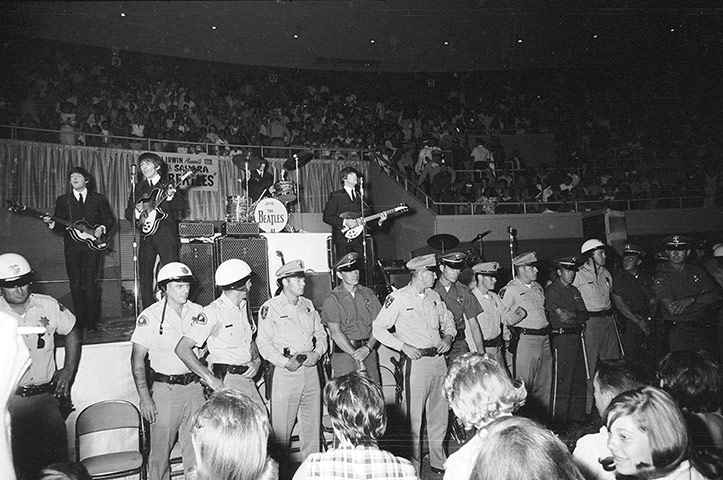 Beatles in America: a line of police officers prevent fans from getting too close