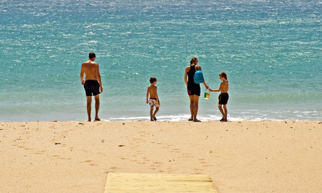 Family on beach, Spain