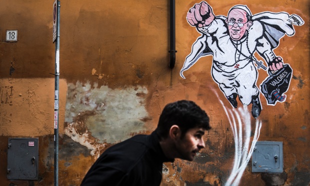 Pope Francis represented as a Super Hero by italian artist Mauro Pallotta aka MAUPAL, on the wall in a street nearby St. Peter's Basilica.