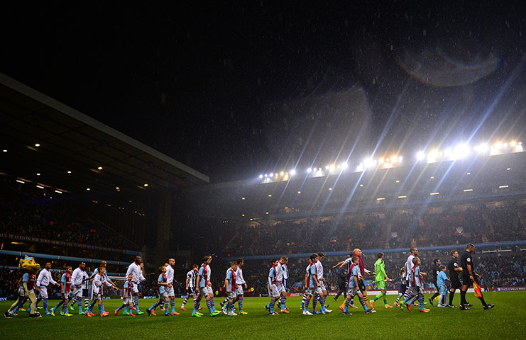 Wednesday's games: Refereee Mark Clattenburg leads the teams out