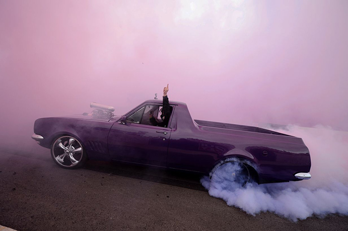 Summernats: A driver salutes the crowd