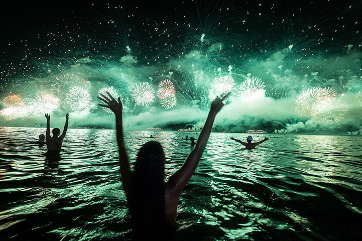 20 Photos: People celebrate the New Year at Copacabana beach in Rio de Janeiro, Brazil
