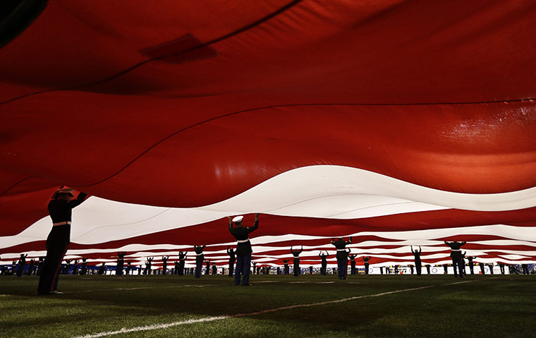 20 Photos: United States Marines hold an American flag in San Diego