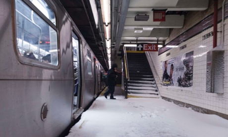 Snow makes it way down to the platform of the 65th Street subway station during a winter storm in New York, 3 January, 2014