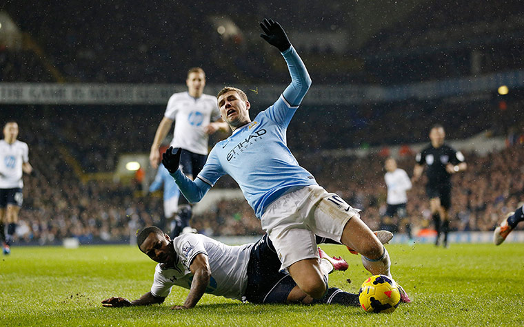 Spurs v Man City: Edin Dzeko is fouled by Danny Rose