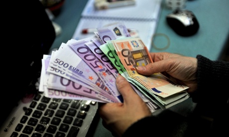 An exchange office clerk counts Euro banknotes in Istanbul, Turkey, January 29, 2014.