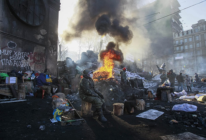20 Photos: Anti-government protesters near a fire next to Independence Square in Kiev