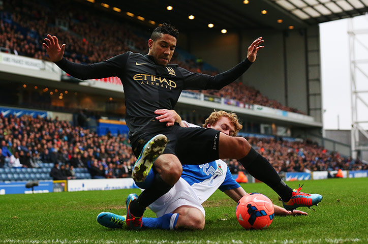 FA Cup 3rd round: Gael Clichy is dispossessed by Chris Taylor