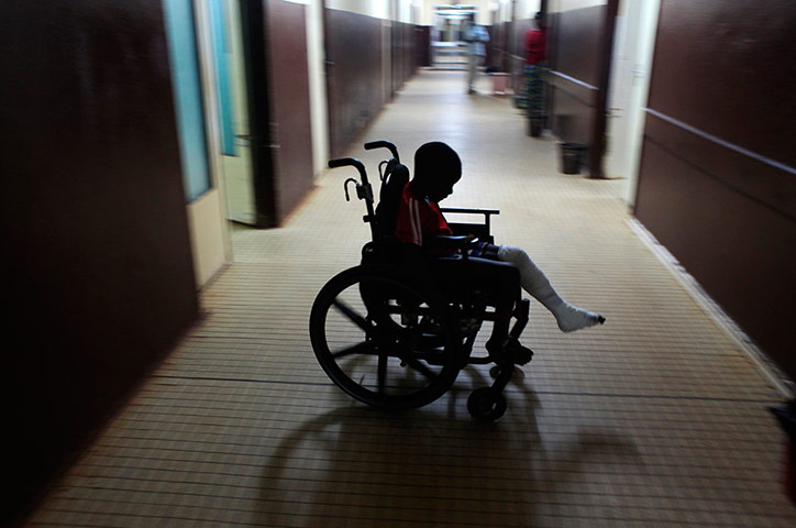 20 Photos: A boy in a wheelchair wounded from a grenade in Central African Republic