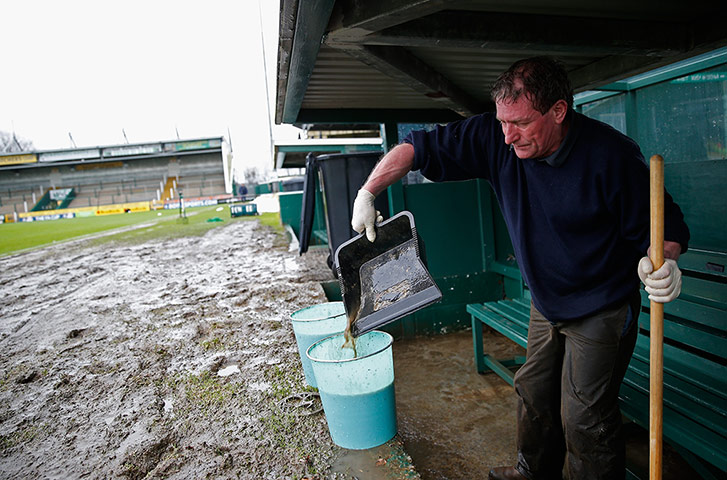 FA Cup 3rd round: Groundsman bails out water at Yeovil
