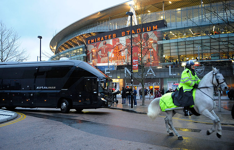 Arsenal v Spurs: A white police horse guides the Spurs team coach into the stadium