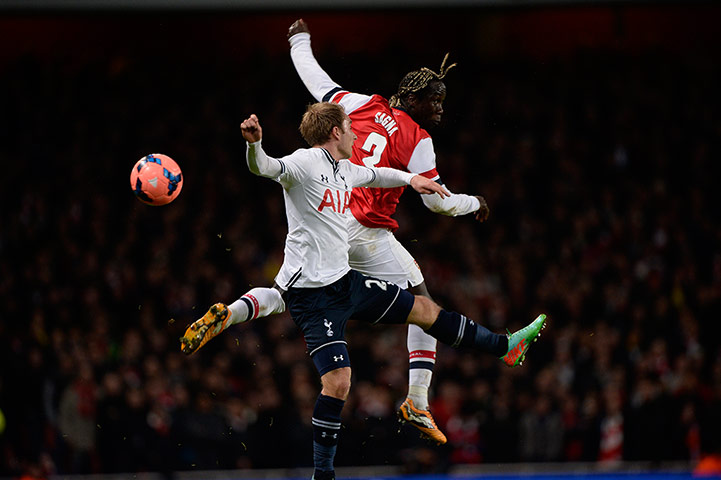 Arsenal v Spurs: Barcary Sagna wins an aerial duel