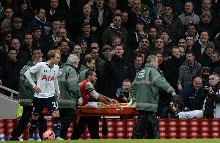 Arsenal versus Spurs: Theo Walcott is stretchered off