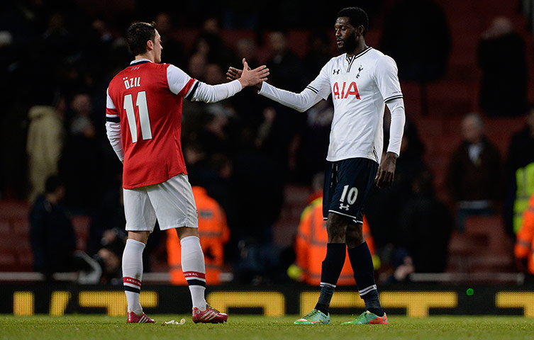 Arsenal versus Spurs: Mesut Ozil and Emmanuel Adebayor shake hands