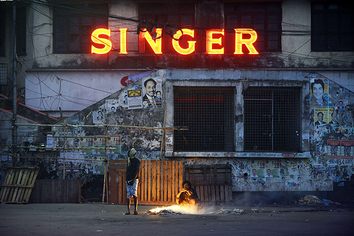 Weekend in pictures: Men stand near a fire in Dhaka, Bangladeshi, during a cold winter morning 