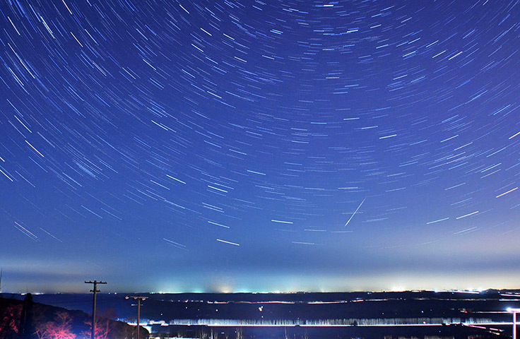 Weekend in pictures: A meteor streaks past stars during the annual Quadrantid meteor shower in Q