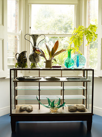 Homes - Hollicks House: Glass cabinet in house with vases on top