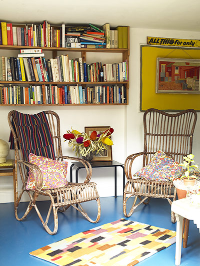Homes - Hollicks House: chairs in living/dining room with bookshelves on walls