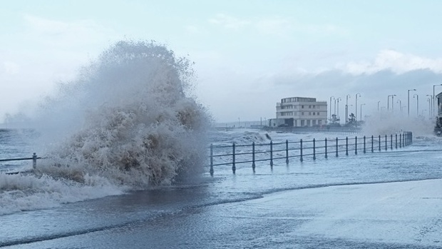A partially flooded promenade in front of Midland Hotel, Morecambe.
