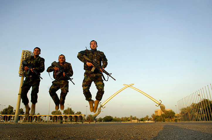 Big Picture - Iraq Flying: Three Iraqi soldiers jumping