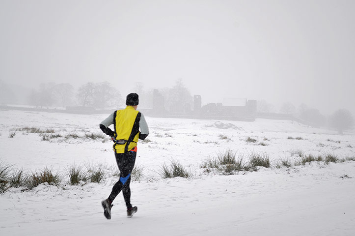 Your Pics - Resolutions: man running out in snowy weather