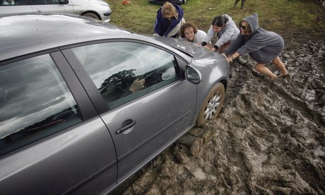 Festival Goers Depart From A Muddy Glastonbury