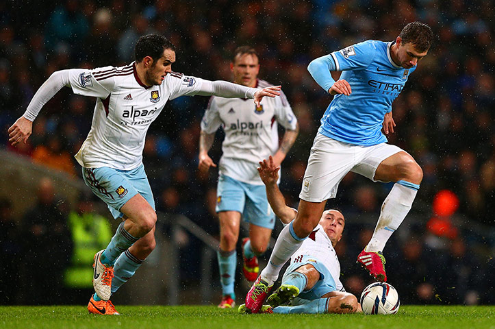 Man City v West Ham Utd: Edin Dzeko is marshalled by Joey O'Brien 