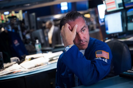 A trader works on the floor of the New York Stock Exchange during afternoon trading on October 9, 2014 in New York City.