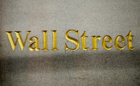 A Wall Street address is carved in the side of a building in New York.
