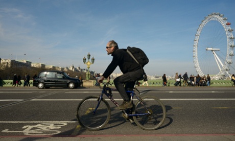 A cyclist on Westminster Bridge in central London.