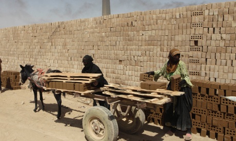 An Iraqi woman from southern Iraq works at a brick factory in Baghdad
