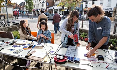 Demand Energy Equality members show people how to make solar panels in Oxford